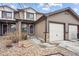Attractive townhome with attached garage and cozy front yard at 371 Smith Cir, Erie, CO 80516