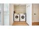 Convenient laundry room with modern washer and dryer units and ample storage at 371 Smith Cir, Erie, CO 80516