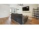 Inviting living room featuring hardwood floors, a comfortable sofa, and a ceiling fan at 371 Smith Cir, Erie, CO 80516