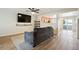 Comfortable living space with a view into the kitchen and a large window for natural light at 371 Smith Cir, Erie, CO 80516