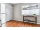 Bright entryway features hardwood flooring, a window, and a console table with decor at 6650 E Arizona Ave # 154, Denver, CO 80224