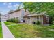 Charming home exterior with a well-manicured lawn and mature trees offering shade at 6650 E Arizona Ave # 154, Denver, CO 80224