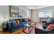 Cozy living room with sofa, chairs, stylish decor and a view of the entryway table at 6650 E Arizona Ave # 154, Denver, CO 80224