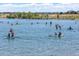 Scenic view of the Aurora Reservoir with people paddleboarding and kayaking on a sunny day at 24269 E Arapahoe Pl, Aurora, CO 80016