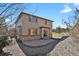A home's backyard with small pebbles, concrete patio, and a wrought iron fence at 24269 E Arapahoe Pl, Aurora, CO 80016