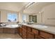 Bathroom featuring dual sinks, a bathtub, and a separate shower at 24269 E Arapahoe Pl, Aurora, CO 80016