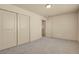 Bedroom features carpet, closet with sliding doors, and multiple entryways at 24269 E Arapahoe Pl, Aurora, CO 80016
