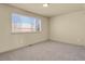 Neutral bedroom with carpet, window, base molding, and flush ceiling lighting at 24269 E Arapahoe Pl, Aurora, CO 80016