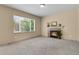 Bright living room boasts a fireplace, neutral carpet, a large window and neutral colored walls at 24269 E Arapahoe Pl, Aurora, CO 80016