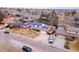 An aerial view of the home showcasing solar panels on the roof and neighborhood at 6410 S Kendall St, Littleton, CO 80123