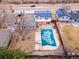 Aerial view of a home with solar panels, covered pool, and residential neighborhood at 6410 S Kendall St, Littleton, CO 80123