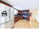 Spacious kitchen featuring stainless steel appliances and hardwood floors at 6410 S Kendall St, Littleton, CO 80123