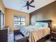 Inviting bedroom with a large window, a ceiling fan and neutral decor at 3230 Boulder Cir # 101, Broomfield, CO 80023