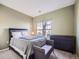 Cozy bedroom featuring carpeted floors and a large window for natural light at 3230 Boulder Cir # 101, Broomfield, CO 80023