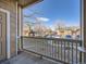 Inviting front porch view with railing overlooking a well-maintained neighborhood street at 3230 Boulder Cir # 101, Broomfield, CO 80023