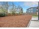 Large, mulch-covered backyard with a tall wooden fence, ideal for outdoor activities and relaxation at 5326 Lowell Blvd, Denver, CO 80221