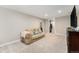 Spacious basement featuring plush carpeting, recessed lighting, closet, and comfortable seating area with a couch at 5326 Lowell Blvd, Denver, CO 80221
