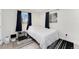 Cozy bedroom with light-filled windows and modern decor at 5326 Lowell Blvd, Denver, CO 80221