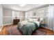 Comfortable bedroom with hardwood floors, bright windows, and a cozy rug, offering a serene retreat at 5326 Lowell Blvd, Denver, CO 80221
