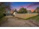 Charming home featuring a well-maintained yard, detached garage, and a new wooden fence at 5326 Lowell Blvd, Denver, CO 80221