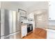 Well-lit kitchen featuring modern stainless steel appliances, butcher block countertops, and ample storage space at 5326 Lowell Blvd, Denver, CO 80221