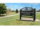 Rocky Mountain Lake Park sign amidst a grassy area, with a walkway and trees visible in the background at 5326 Lowell Blvd, Denver, CO 80221