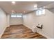 Open basement with painted walls, recessed lighting, vinyl flooring, and window at 1844 S Lincoln St, Denver, CO 80210