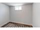 Small basement room with carpeting, painted walls, and a small window at 1844 S Lincoln St, Denver, CO 80210