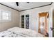 Bedroom featuring a closet, light walls, and an entrance to another room at 1844 S Lincoln St, Denver, CO 80210