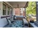 Cozy front porch with comfortable seating and stylish decor at 1844 S Lincoln St, Denver, CO 80210