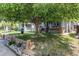 Charming home with mature tree shading the front yard and landscaped garden at 1844 S Lincoln St, Denver, CO 80210