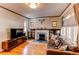 Inviting living room with hardwood floors, fireplace, and ample natural light at 1844 S Lincoln St, Denver, CO 80210