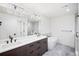 Luxurious bathroom with dual sinks, a soaking tub, and a glass-enclosed shower at 556 Monroe St, Denver, CO 80206