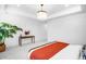 Serene bedroom featuring a decorative light fixture and minimalist design at 556 Monroe St, Denver, CO 80206