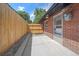 Property featuring a privacy fence and back door at 3738 N Eliot St # 2, Denver, CO 80211