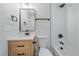 Modern bathroom featuring a tiled shower and updated vanity at 3738 N Eliot St # 2, Denver, CO 80211