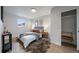 Comfortable bedroom featuring stylish decor, wood floors, and natural light at 3738 N Eliot St # 2, Denver, CO 80211