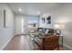 Cozy living room featuring a sectional couch, stylish decor, and plenty of natural light from a window at 3738 N Eliot St # 2, Denver, CO 80211