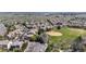 Aerial view of neighborhood near open space with sprawling green grass at 11935 E Lake Ct, Greenwood Village, CO 80111