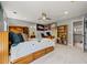 Bedroom features a ceiling fan, bookshelves and ensuite bathroom at 11935 E Lake Ct, Greenwood Village, CO 80111