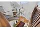 Grand foyer featuring hardwood floors, ornate chandelier, staircase and open living room at 11935 E Lake Ct, Greenwood Village, CO 80111