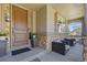 Inviting front porch with stone accents and seating area at 11935 E Lake Ct, Greenwood Village, CO 80111