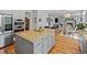 Gourmet kitchen featuring an island and breakfast bar that seats two at 11935 E Lake Ct, Greenwood Village, CO 80111