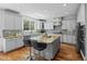 Spacious kitchen features gray cabinets, stainless steel appliances, granite countertops, and hardwood floors at 11935 E Lake Ct, Greenwood Village, CO 80111