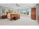 Spacious main bedroom with large windows offering scenic views and a ceiling fan at 11935 E Lake Ct, Greenwood Village, CO 80111