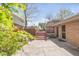 Private brick patio with a raised deck, perfect for outdoor living and entertaining in a serene setting at 3242 4Th St, Boulder, CO 80304