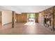 Basement with stone fireplace and tile floors, and access to backyard at 3242 4Th St, Boulder, CO 80304