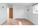 Bedroom with hardwood floors, closet, and doorway at 3242 4Th St, Boulder, CO 80304