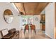 Dining area boasts hardwood floors, modern lighting, and large windows with backyard views at 3242 4Th St, Boulder, CO 80304
