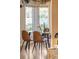 Bright dining area featuring a glass table, modern chairs, and natural light from large windows at 3242 4Th St, Boulder, CO 80304